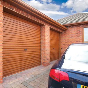 2 brown wooden textured garage doors together
