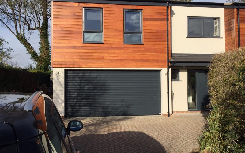 double black garage door on a 2 storey house