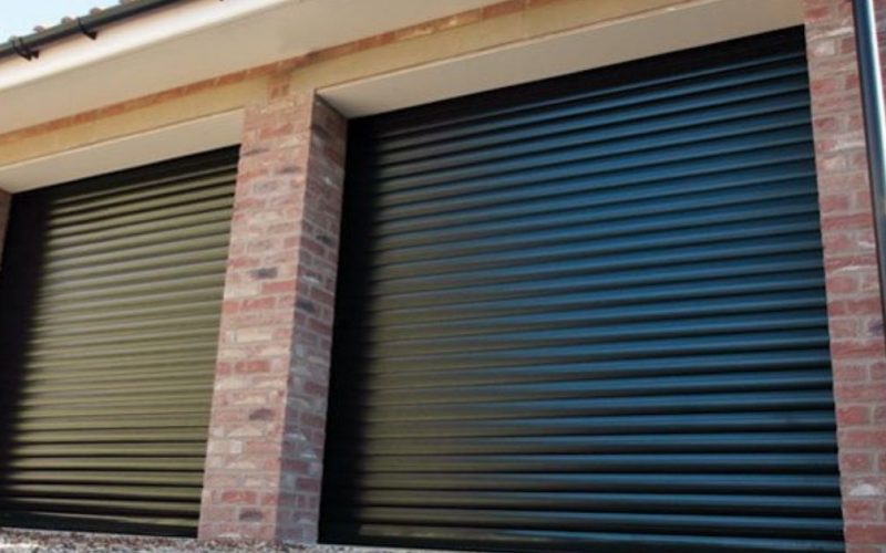 two black garage doors next to each other
