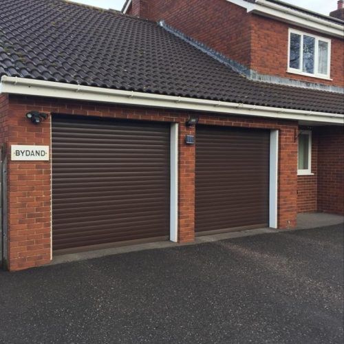 two single roller garage doors in brown