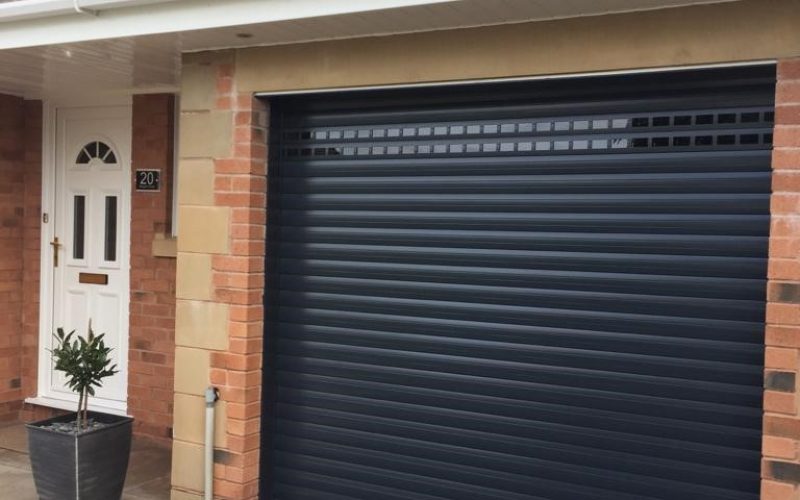 black shutter garage door at the front of a house