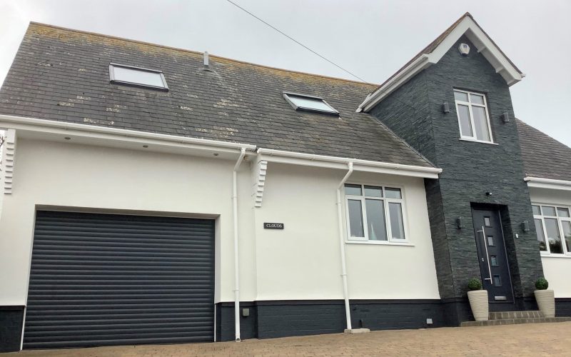 new garage door & front door on a large home